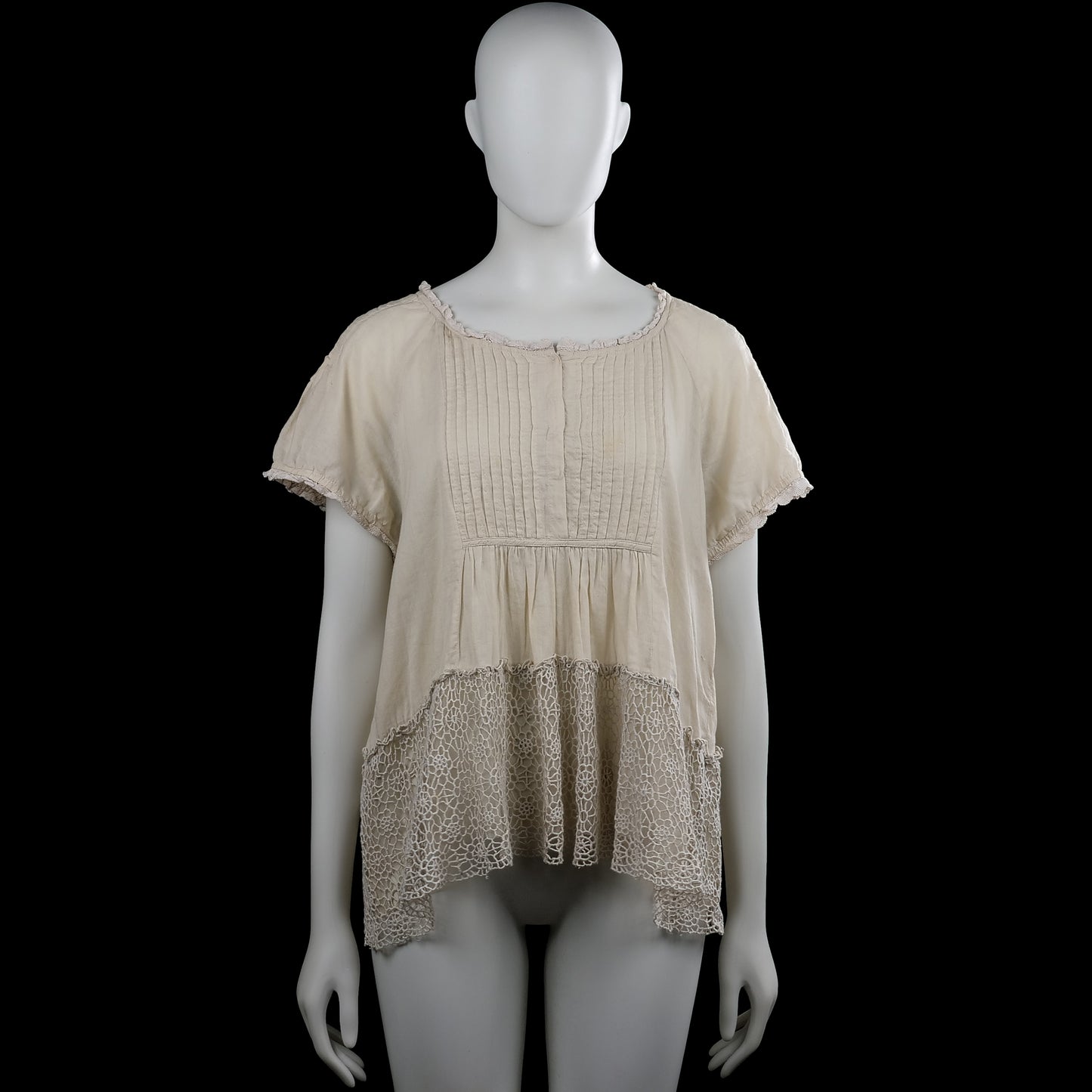 Raselbud - Tunic - Ivory - Size M - Ivory solid short-sleeve top with a scoop neckline and lace trim at the neckline and sleeve hems. Features pintuck pleats on the front and a high-low hem with a lace panel at the bottom.
