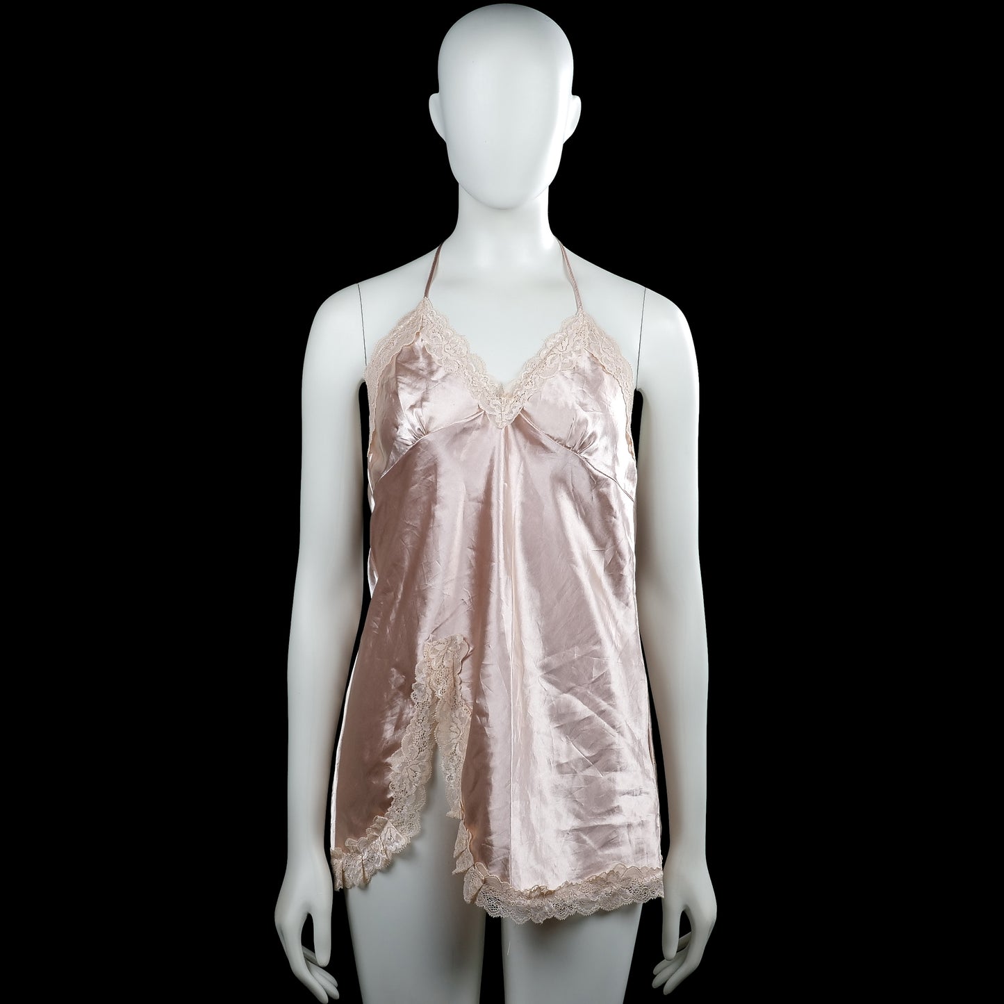 Tunic - Light Pink & Beige - Size M - Light pink slip dress with a solid design, V-neckline, and sleeveless halter straps tied at the back. Features beige lace trim along the neckline and straight hem.