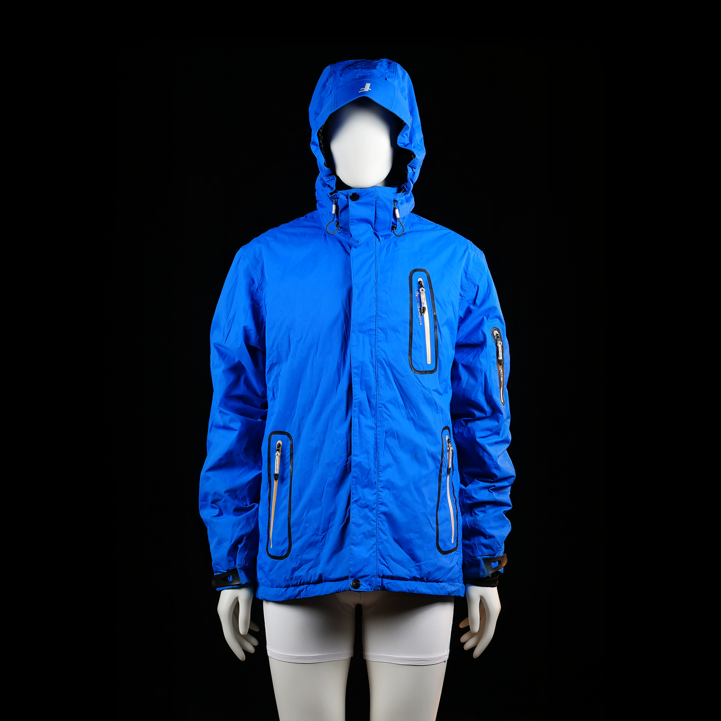 Five Seasons - Rain jacket - Sky Blue - Size L - Hooded jacket with multiple vertical and slanted zippered pockets on the chest, waist, and sleeve, featuring black trim details. Cuffs are adjustable with Velcro straps.