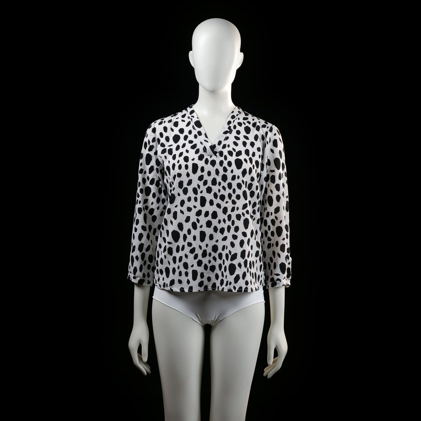 Savinni - Blouse - White & Black - Size S - Long-sleeve blouse with a V-neckline and an all-over irregular black spot print. Features sleeves with button tab detailing near the cuffs.