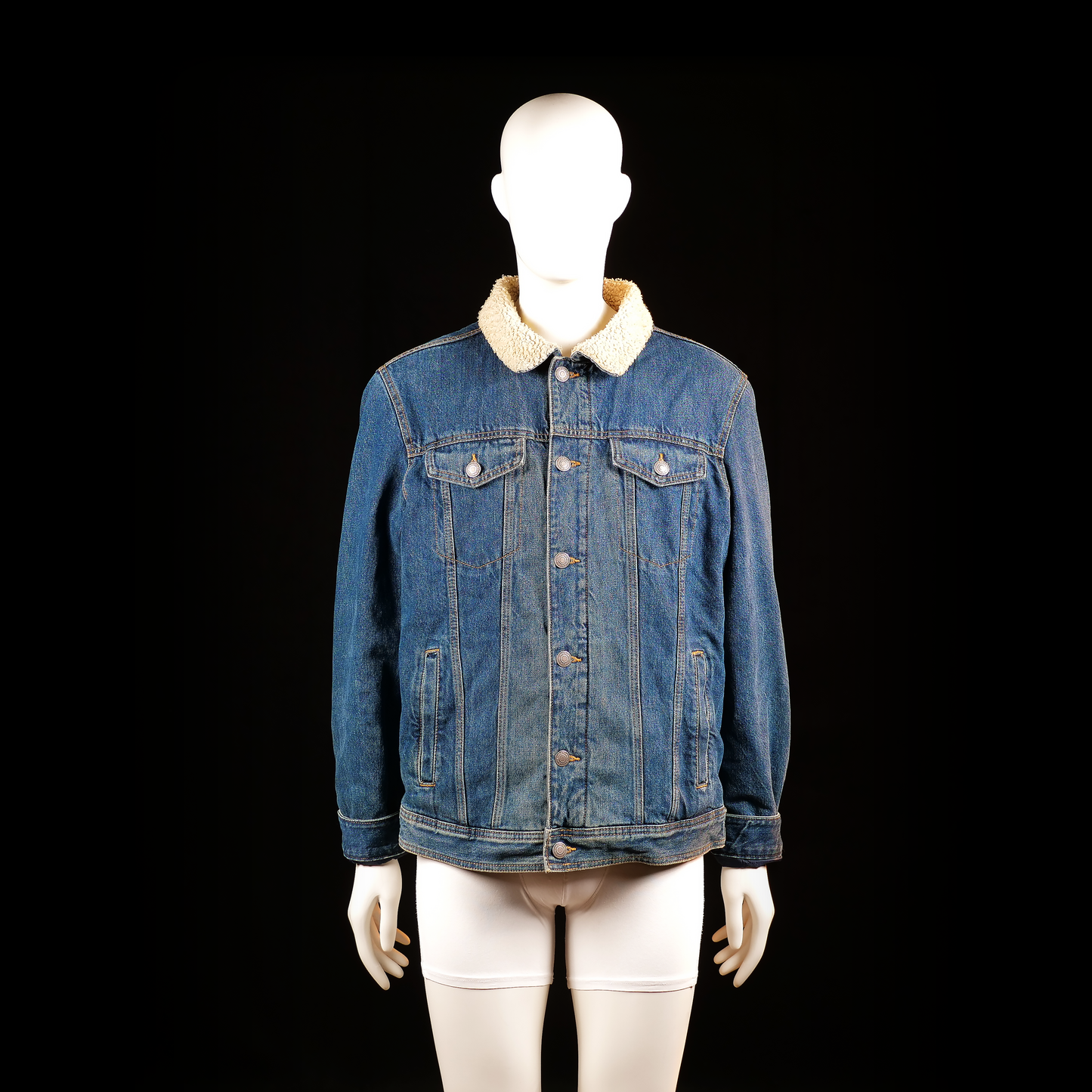 The Denim - Denim jacket - Denim Blue & Ivory - Size L - Blue denim jacket with a visible sherpa-lined collar, button-up front, and dual flap chest pockets. Vertical welt pockets and structured panel seams add definition.
