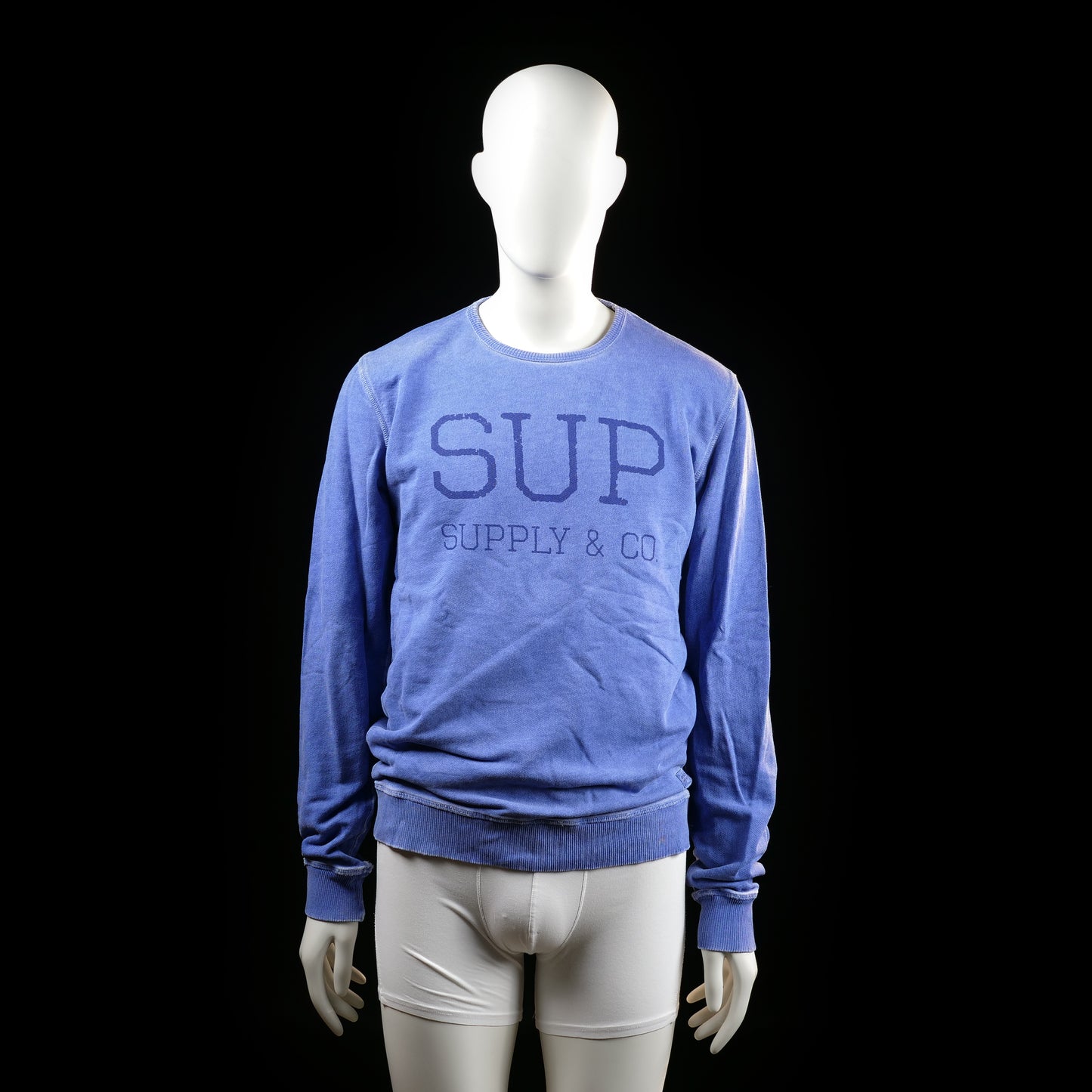 Supply & Co. - Sweatshirt - Indigo - Size M - Long-sleeve crewneck sweatshirt featuring ribbed cuffs and hem. Large tonal text print on the front reading "SUP SUPPLY & CO."