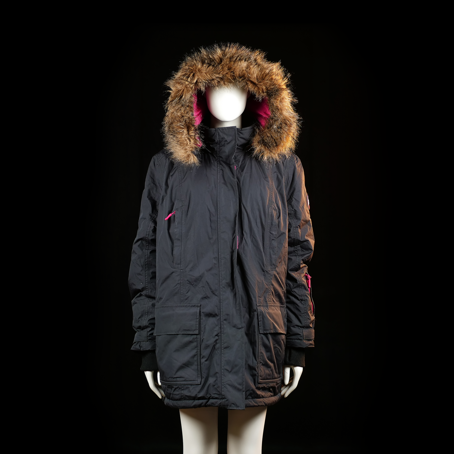 Bonprix - Parka - Black & Pink - Size 50 - Long-length black coat with a fur-trimmed hood and pink zipper pulls and accents. Features flap front pockets, ribbed cuffs, and a patch on the upper sleeve.