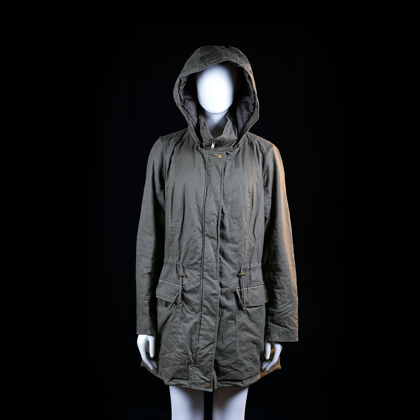 Ms Mode - Parka - Olive - Size 42 - Long hooded coat with a drawstring waist and flap pockets. Features metallic stud embellishments in a large pattern across the back panel.