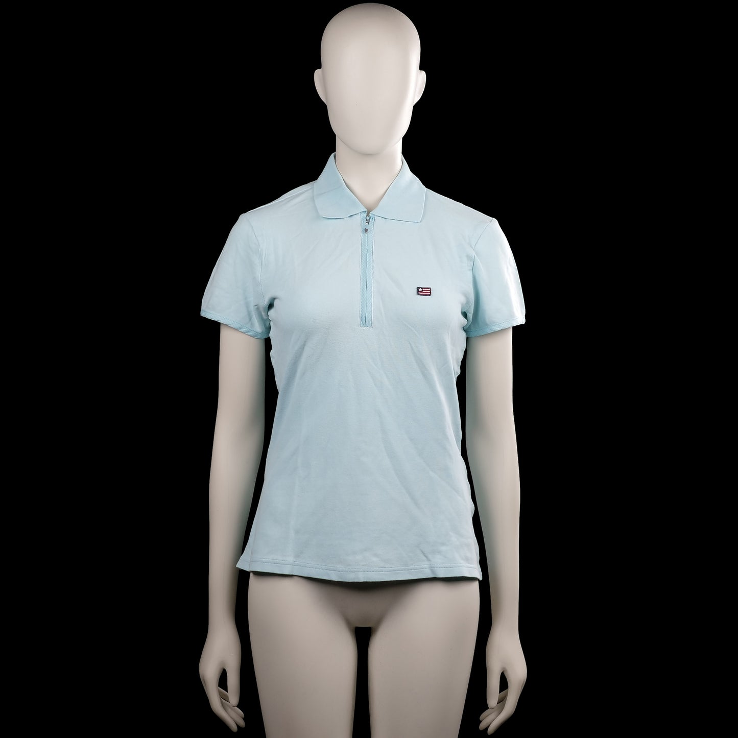 Flash - T-shirt - Light Blue - Size M - Light blue solid polo shirt with a polo collar and a short front zipper. Short sleeves with plain cuffs and a straight hem.