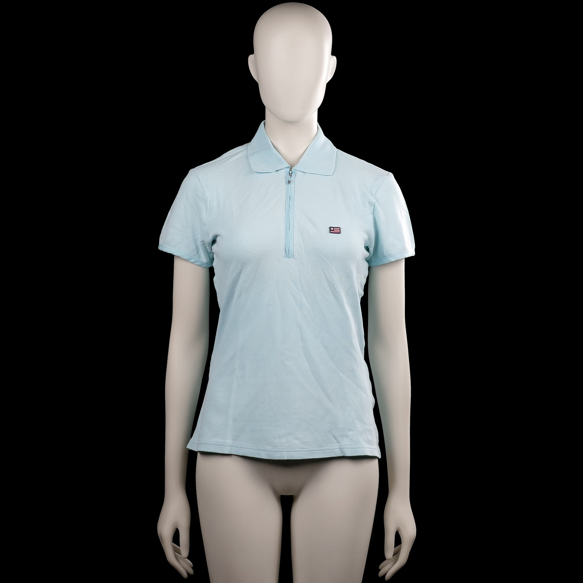 Flash - T-shirt - Light Blue - Size M - Light blue solid polo shirt with a polo collar and a short front zipper. Short sleeves with plain cuffs and a straight hem.