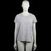 H&m logg disney - T-shirt - Light Gray & Black - Size L - Light gray short-sleeve top with a round neckline and a straight hem. Features an all-over black printed motif.