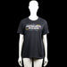 Canvas - T-shirt - Black - Size M - Black short-sleeve T-shirt with a round neck and straight hem. Features a printed front graphic with text and multicolored shapes.