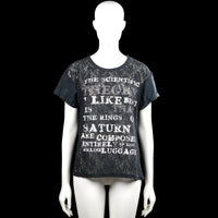 T-shirt - Black & Gray - Size M - Black and gray short-sleeve top with a round neck and straight hem. Features a floral-style overlay effect and white text graphic on the front, with rolled plain cuffs.
