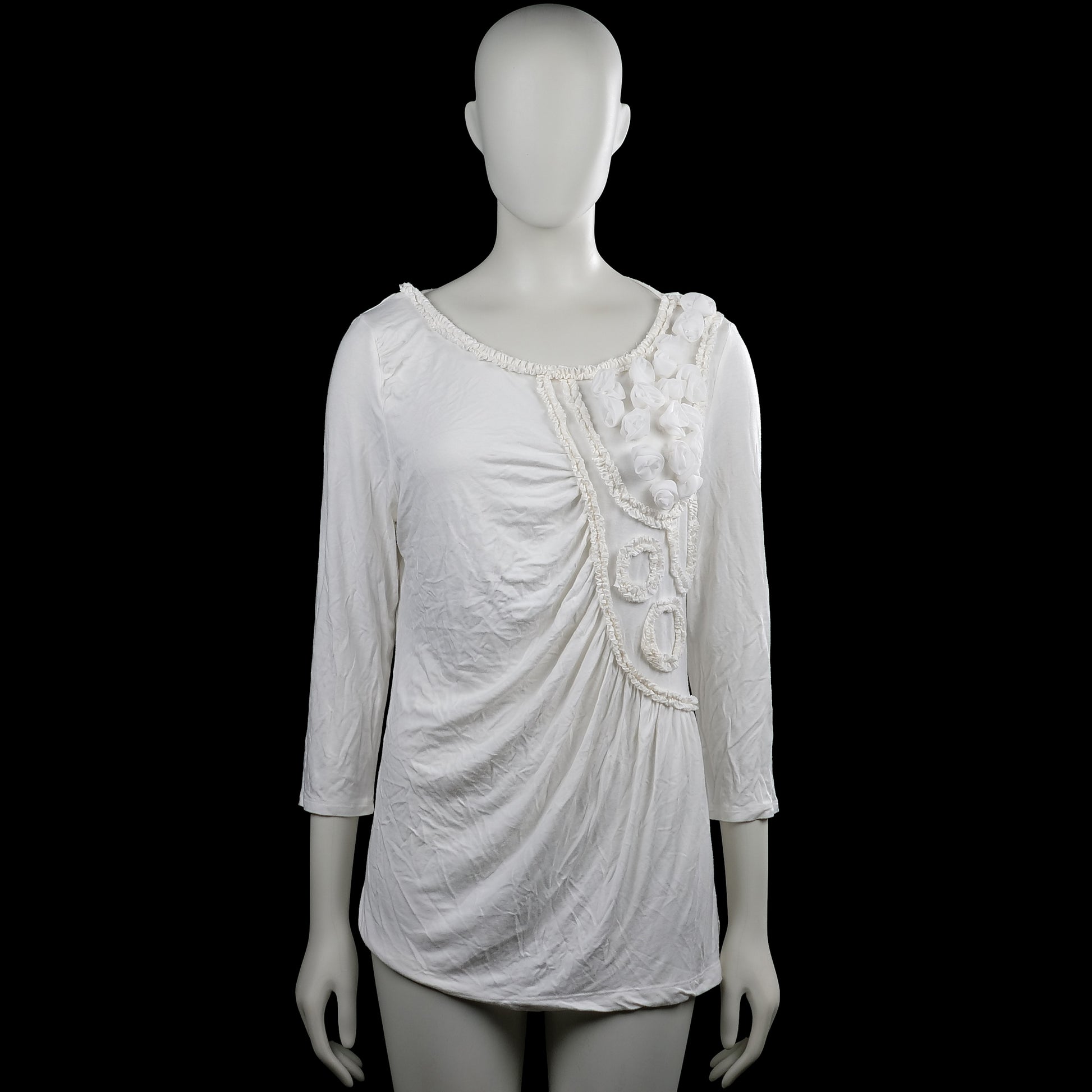 Tesini - Tunic - White - Size 42 - White solid top with a scoop neckline and three-quarter sleeves with plain cuffs. Features ruffled trim and fabric flower appliques on the front and a straight hem.