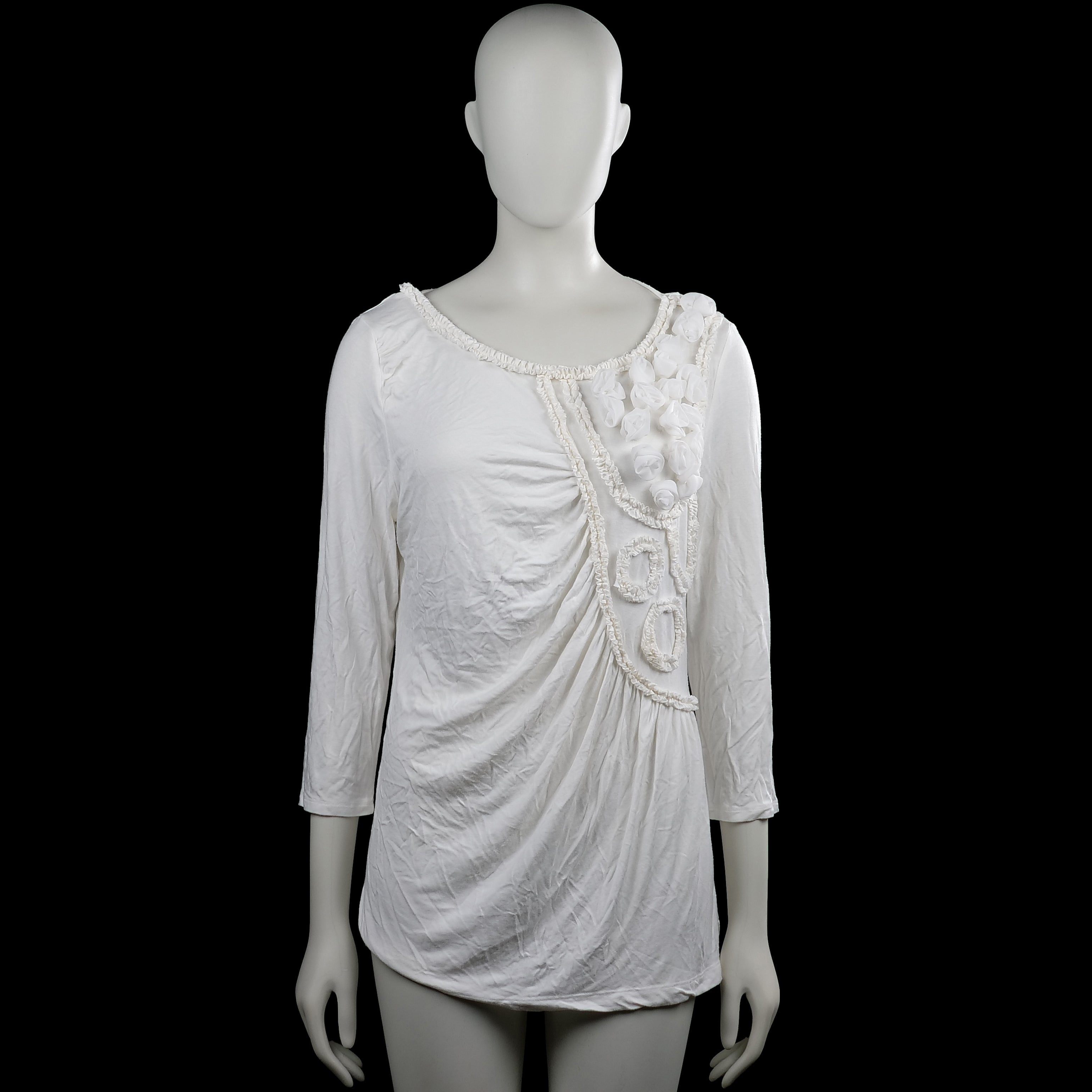 Tesini - Tunic - White - Size 42 - White solid top with a scoop neckline and three-quarter sleeves with plain cuffs. Features ruffled trim and fabric flower appliques on the front and a straight hem.