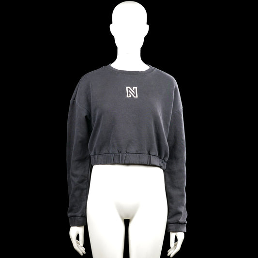Nikkie - Sweatshirt - Charcoal - Size 32 - Charcoal solid sweatshirt with a round neck and long sleeves. Features a small chest logo and an elastic hem with plain cuffs.