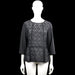 Inwear - Tunic - Black & Gray - Size 38 - Black and gray top with a round neck, three-quarter sleeves, and plain cuffs. Features a floral lace overlay on the front and peplum hem, with a visible back zip closure.