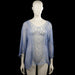Glitzia - Tunic - Light Blue & White - Size L - Light blue semi-sheer top with a scoop neckline and three-quarter sleeves. Features a curved hem and a white front panel with blue floral embroidery.