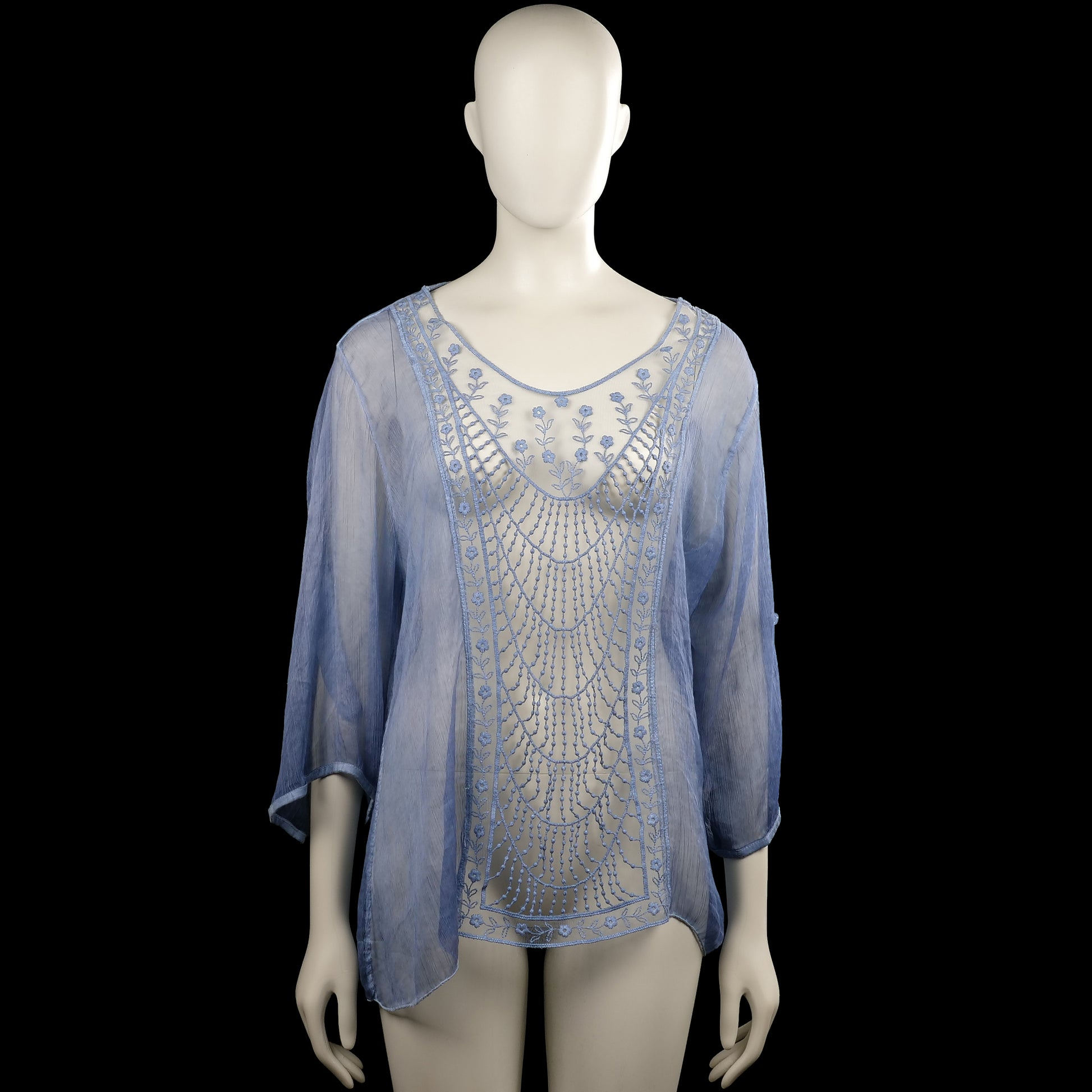 Glitzia - Tunic - Light Blue & White - Size L - Light blue semi-sheer top with a scoop neckline and three-quarter sleeves. Features a curved hem and a white front panel with blue floral embroidery.