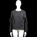 Pimkie - Blouse - Charcoal - Size M - Charcoal solid top with a round neckline and long sleeves featuring layered ruffles along the upper sleeves and sides. Straight hem and a small back keyhole opening with a visible closure at the neckline.