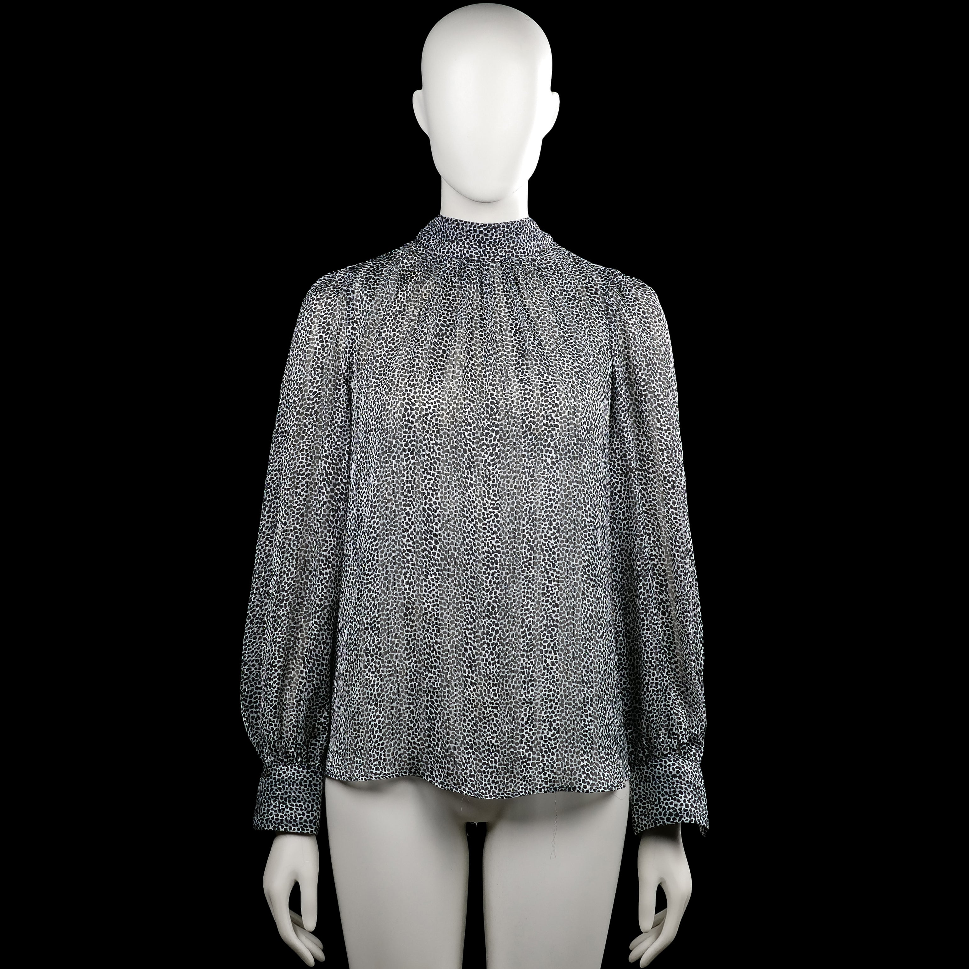 H&M - Blouse - Black & White - Size S - Black and white printed blouse with a high neckline and long sleeves. Features plain cuffs, a partial front opening at the neck, and a curved hem.