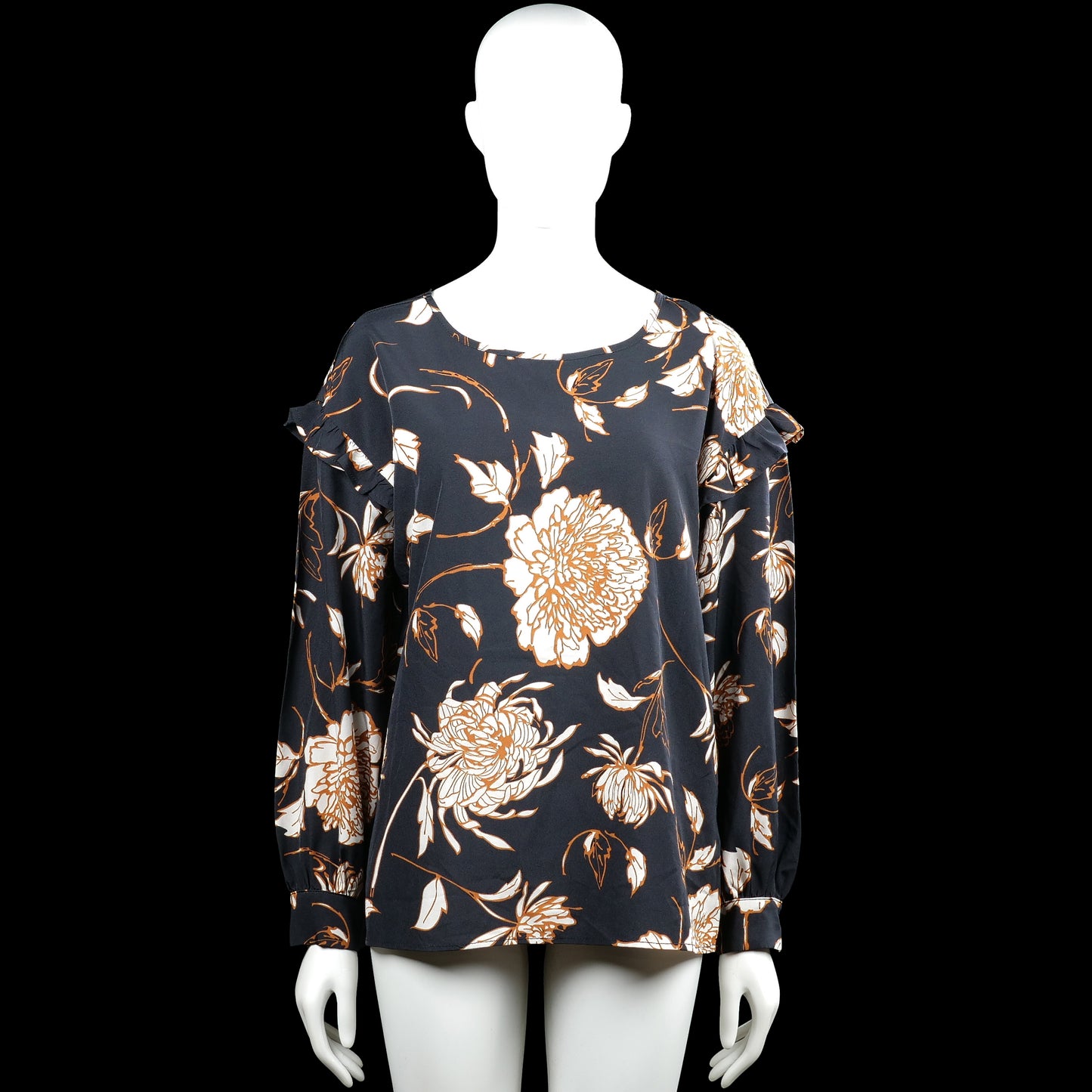 Norah - Blouse - Black & White - Size 40 - Black top with a white floral pattern and a round neckline. Features long sleeves with ruffle details at the upper arms, button cuffs, and a straight hem.