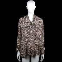 Zara - Tunic - Beige & Black - Size M - Beige and black leopard-pattern blouse with a tie at the V-neckline and long sleeves. Features a ruffled hem and ruffled sleeve ends.