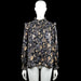 Unika - Blouse - Black & Gray - Size M, L - Black and gray floral blouse with a smocked high ruffle neck and ruffle shoulder details. Long sleeves with elastic smocked cuffs and a straight hem.