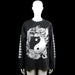 Sweatshirt - Black & White - Size L - Black long-sleeve top with a round neck and straight hem. Features a large white graphic print on the front and back with additional white prints along the sleeves.