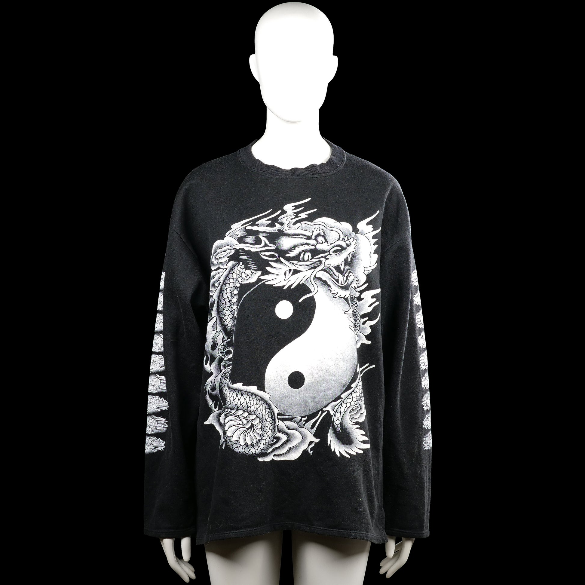 Sweatshirt - Black & White - Size L - Black long-sleeve top with a round neck and straight hem. Features a large white graphic print on the front and back with additional white prints along the sleeves.