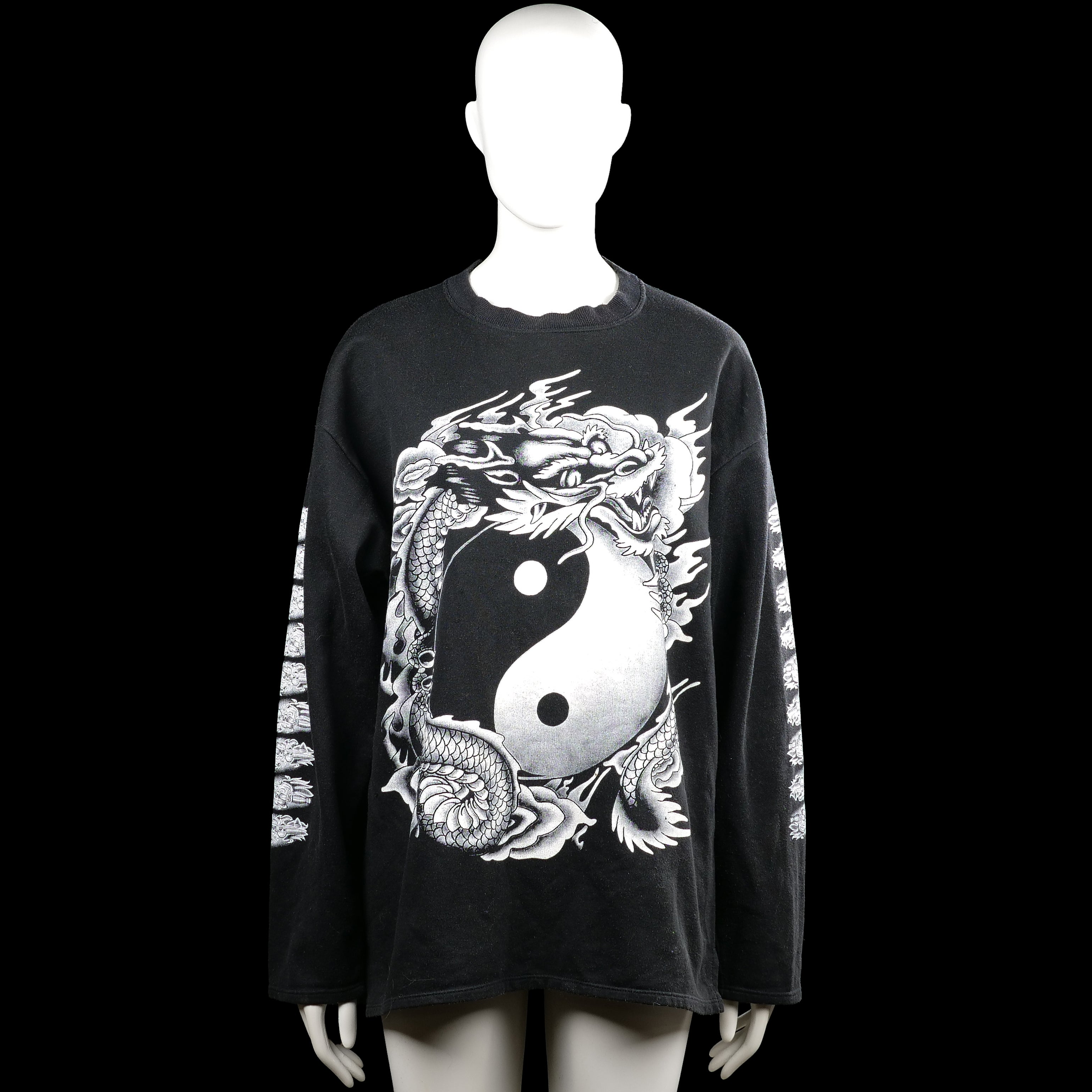 Sweatshirt - Black & White - Size L - Black long-sleeve top with a round neck and straight hem. Features a large white graphic print on the front and back with additional white prints along the sleeves.