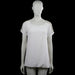 Dazzling - Blouse - White - Size L - White solid top with a scoop neckline and short sleeves. Features decorative cutout trim along the shoulder seams and plain cuffs with a straight hem.