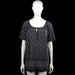 Canda - Tunic - Black & White - Size XL - Black top with a white polka dot pattern and short sleeves. Scoop neckline with a front tie detail and a straight hem.