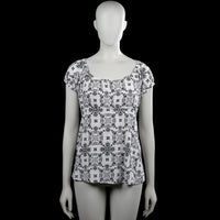Kappahl - Blouse - White & Black - Size M - White top with a black all-over print and a scoop neckline. Features short puff sleeves with elastic cuffs and a straight hem.