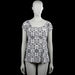 Kappahl - Blouse - White & Black - Size M - White top with a black all-over print and a scoop neckline. Features short puff sleeves with elastic cuffs and a straight hem.