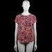 H&M - Blouse - Navy & Orange - Size 38 - Navy and orange floral top with a round neckline and short sleeves. Straight hem and a small keyhole opening at the back neckline.