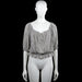 Lindex - Blouse - White & Black - Size M - White top with thin black vertical stripes and a scoop neckline with a front tie opening. Short sleeves with elastic cuffs and an elastic hem with a ruffled edge.
