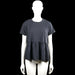 157 - Tunic - Dark Gray - Size M - Dark gray solid top with a round neck and short sleeves. Features a gathered ruffle hem and plain cuffs.