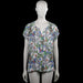 Anna blue - Blouse - Multicolored - Size L - Multicolored printed top with a V-neck and short sleeves. Features a front tie at the neckline with tassel ends and a straight hem.