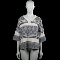 Sweater - Ivory & Black - Size L - Ivory and black patterned top with a V-neck and three-quarter sleeves. Features a straight hem and decorative fringe trim across the upper chest and back.