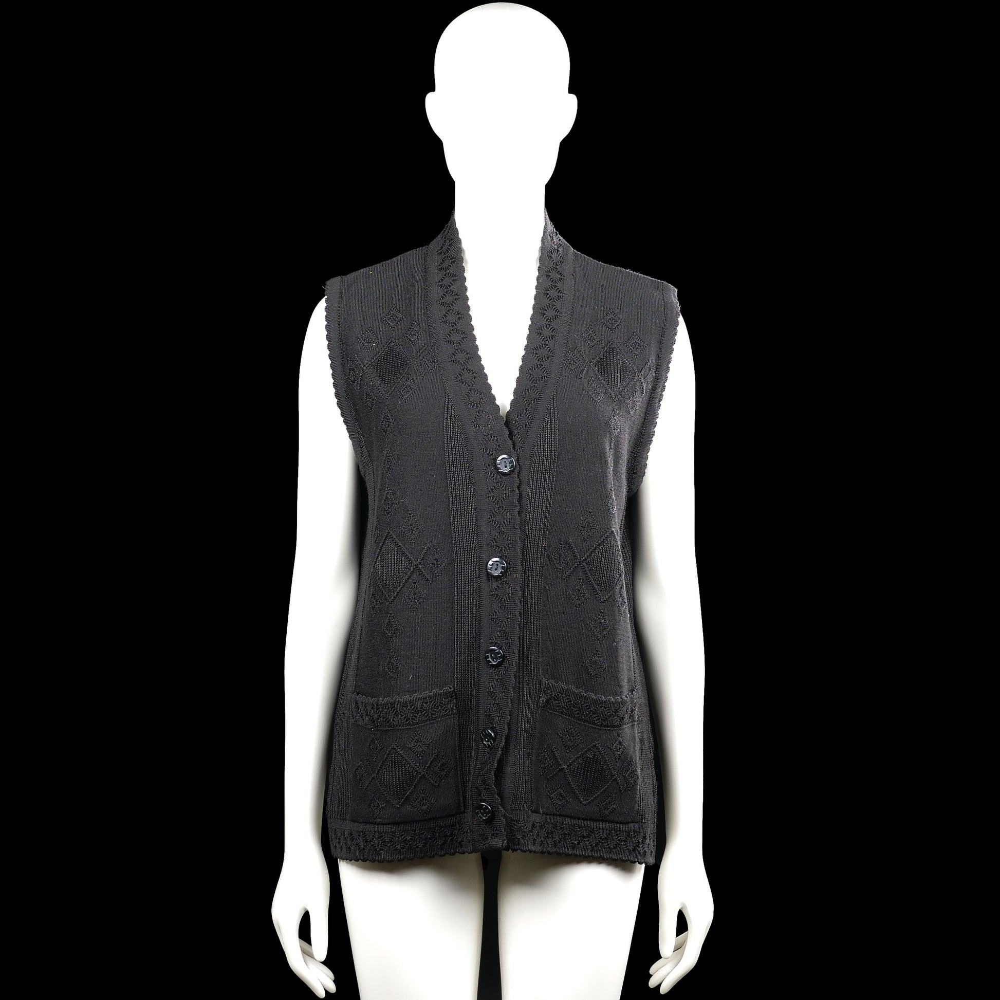 Doga - Suit vest - Black - Size M - Black sleeveless vest with a V-neck and button-front closure. Features a textured diamond pattern, two front patch pockets, and a straight hem.