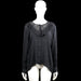 Isolde - Blouse - Black - Size XL - Black solid long-sleeve blouse with a round neckline, ruffle trim around the yoke, and a button-down front. Curved hem and button cuffs.