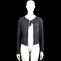 157 - Cardigan - Charcoal - Size S - Charcoal solid open-front cardigan with a round neckline and a tied bow closure at the chest. Long sleeves with plain cuffs and a straight hem.