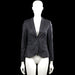 Vacknox - Blazer - Black - Size 32 - Black solid blazer with a V-neck opening and lapel collar, featuring a two-button front closure. Long sleeves have buttoned cuffs and the front has flap pockets with a curved hem.