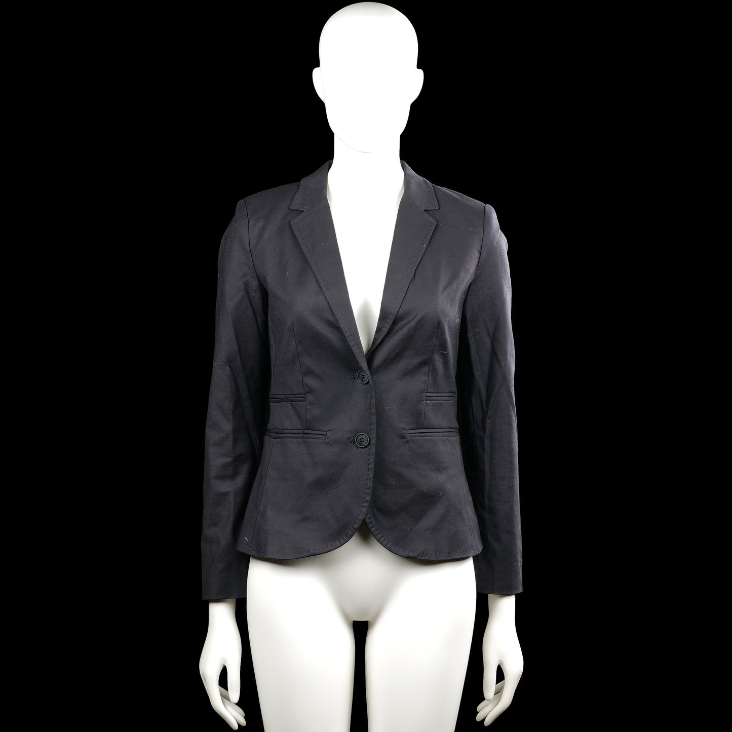 Vacknox - Blazer - Black - Size 32 - Black solid blazer with a V-neck opening and lapel collar, featuring a two-button front closure. Long sleeves have buttoned cuffs and the front has flap pockets with a curved hem.