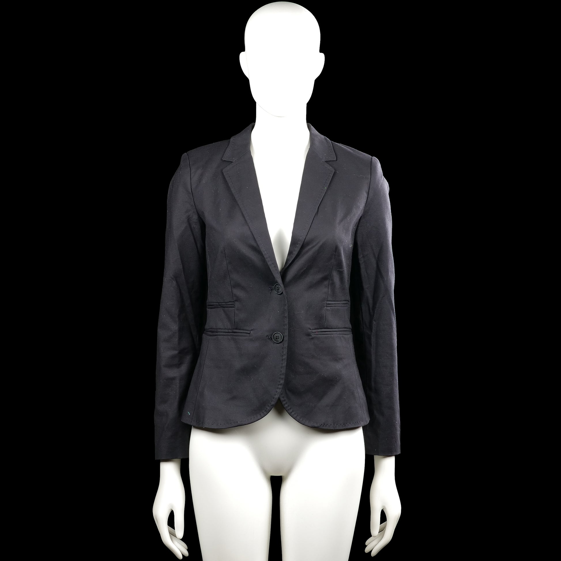 Vacknox - Blazer - Black - Size 32 - Black solid blazer with a V-neck opening and lapel collar, featuring a two-button front closure. Long sleeves have buttoned cuffs and the front has flap pockets with a curved hem.