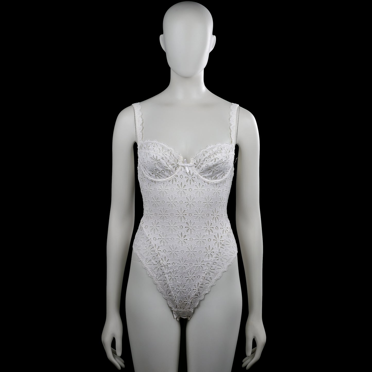 Chantelle - Bodysuit - White - Size XS - White sleeveless lace bodysuit with a scoop neckline and shoulder straps. Features floral lace patterning with a scalloped asymmetrical hem and a small bow at the front.