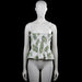 H&M - Tank top - White & Olive - Size S - White sleeveless top with an olive leaf floral pattern and shoulder straps tied in bows. Features a squared neckline, smocked body, and a ruffled hem.