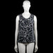 City life - Tank top - Black & White - Size L - Black and white sleeveless top with an abstract print and a scoop neckline. Features an elastic hem and a short front placket with buttons.