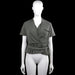 Even & do - Blouse - Olive - Size S - Olive solid top with a V-neck wrap front, short sleeves with button tabs, and a ruffle hem. Features a chest patch pocket and a self-tie belt at the waist.