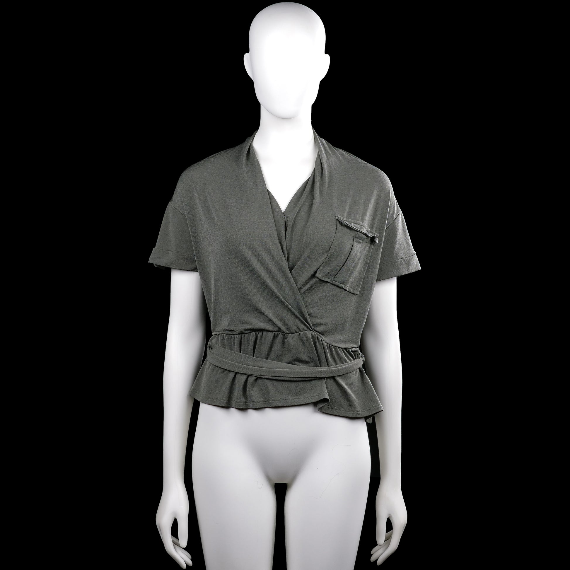 Even & do - Blouse - Olive - Size S - Olive solid top with a V-neck wrap front, short sleeves with button tabs, and a ruffle hem. Features a chest patch pocket and a self-tie belt at the waist.