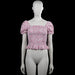 Uniq young - Blouse - White & Pink - Size 170 - White top with a pink floral pattern and a squared neckline. Features short puff sleeves with elastic cuffs, a smocked bodice, and a ruffled hem.