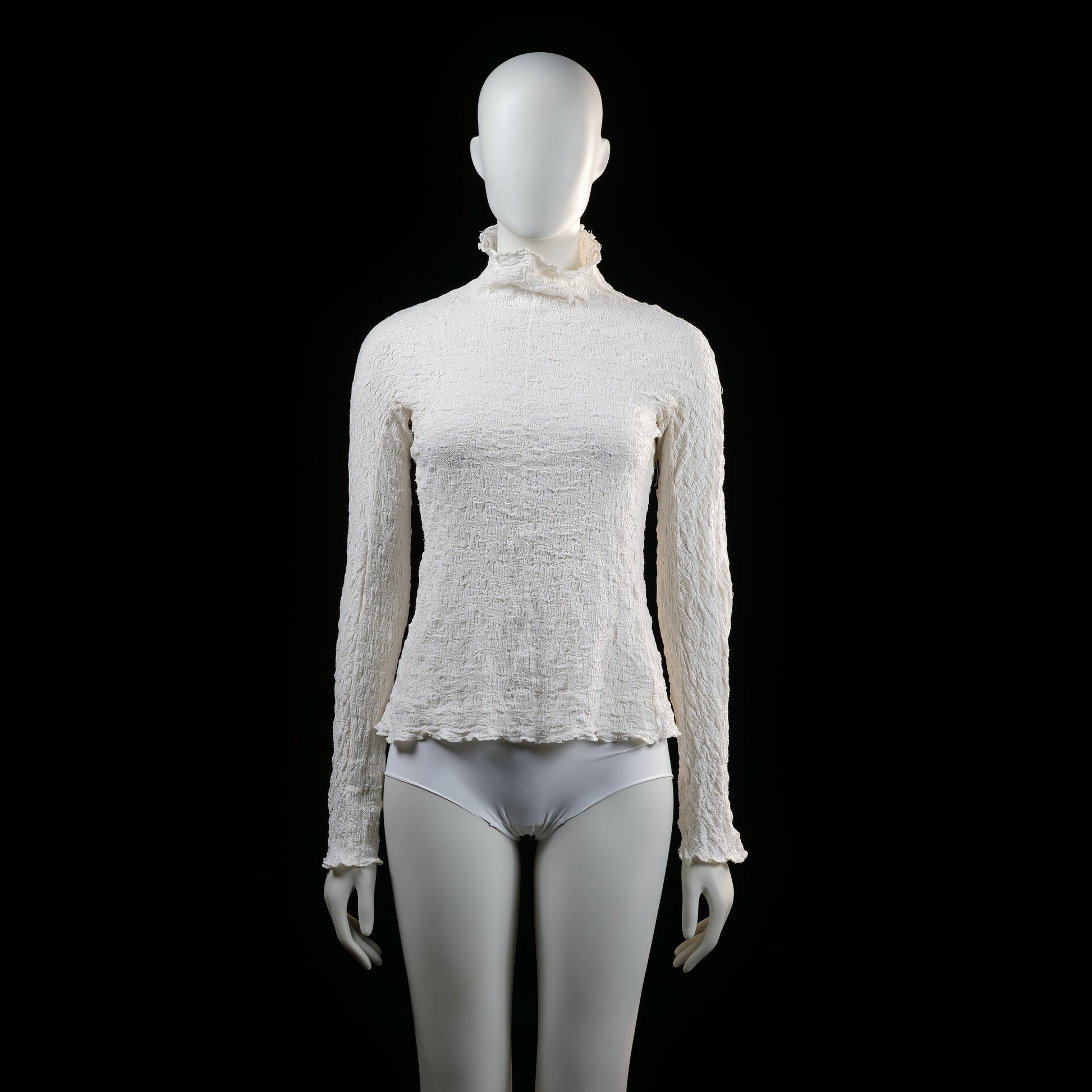 Wera - Blouse - Ivory - Size XS - Long sleeve top with a crinkled texture, high ruffled neckline, and slight ruffle edging at the cuffs and hem.