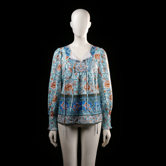 Blouse - Light Blue & Rust - Size S - Long-sleeve floral printed top with a gathered neckline and tassel ties. Features smocked cuffs and a border print along the hem and sleeves.